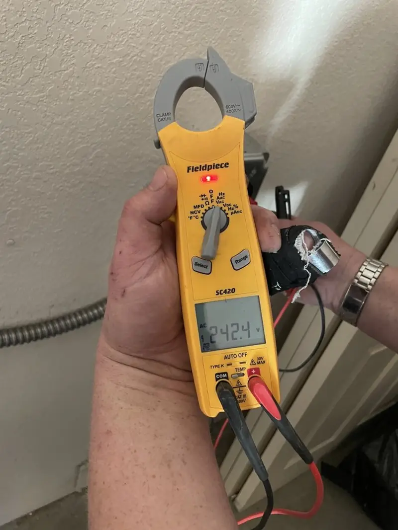 Voltage testing with clamp meter during Electrical Installation Services in Pound Ridge